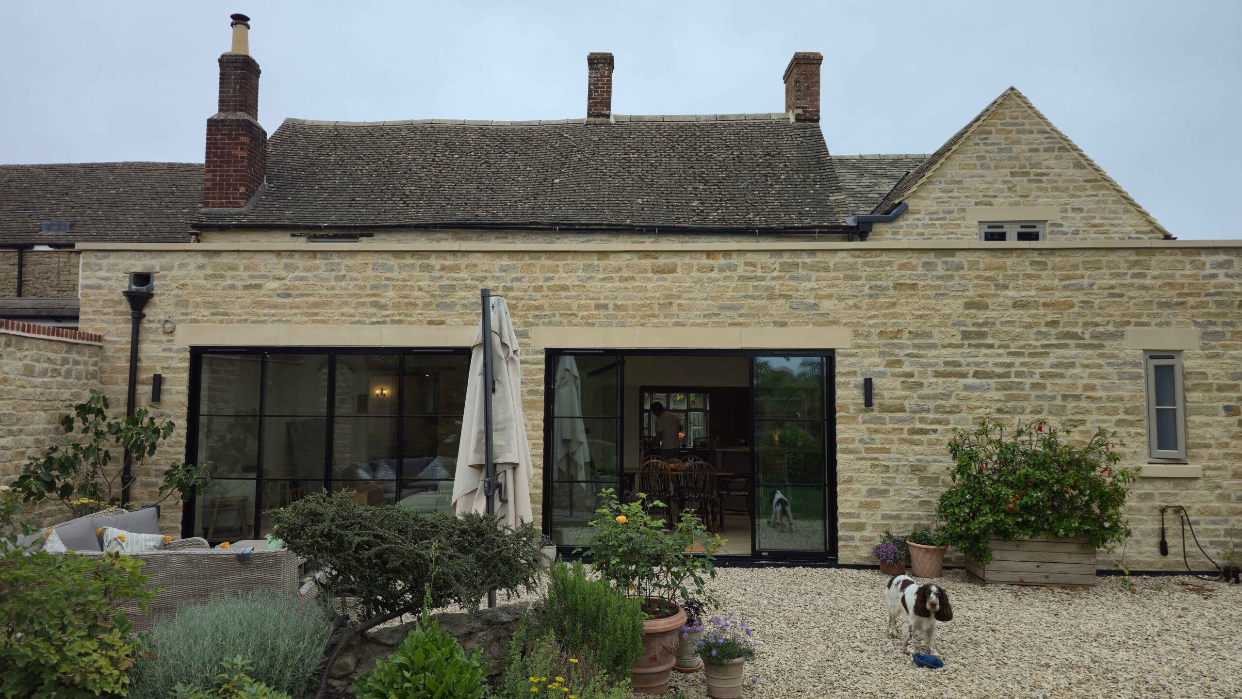 heritage property renovation in the Cotswolds - old stone work exterior and black bifold doors