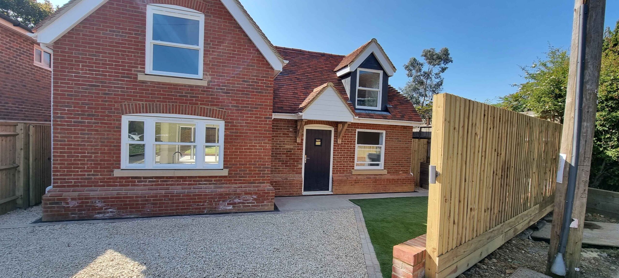 New build using traditional methods in the Cotswolds. Red brick house with period cottage style features